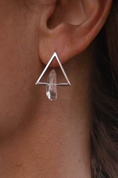 "Simplistic, gorgeous and fierce. These earrings are a perfect blend of modern style and classic elegance! The unique design features a sterling silver triangle shape, with a beautiful clear quartz crystals that add a touch sparkle to the design. Quartz crystal is known for it's ability to amplify energy and intentions and the triangle shape represents change and transformation. ▲ Sterling silver triangle post back earrings ▲ Quartz crystals  ▲ Drop length: approximately 7/8\" ▲ Handmade in Arizona Check out all of our dangle & drop earrings! https://etsy.me/3Ipx0L6 ✦ O R D E R - P R O C E S S I N G - T I M E S ✦ Orders ship 1-3 business days from the date placed. If you need it to ship sooner, please select the expedited shipping option during checkout & your order will ship the following Cosmic Jewelry, Wire Jewelry Tutorial, Birthstone Earrings, Silver Earrings Handmade, The Triangle, Triangle Earrings, Birthstone Earring, Quartz Crystals, Quartz Earrings