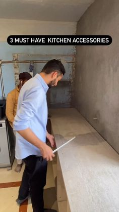 a man is using a knife to cut the counter top