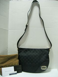 Authentic High End Designer Clothes, Handbags, Shoes, Accessories and Jewelry at Affordable Prices! Always, 100% Authentic Guarantee or 110% Money Back! Since 2001 Fast Shipping-30 Day Hassle Free Returns   New With Tags and Dust Bag Gucci Black GG Motif Logo Canvas with Black Leather Trim Half-Moon Crossbody Bag With Silvertone/Light Goldtone GG Hardware and Zip Top Closure  MADE IN ITALY Approx.  11.5"(Top) W x 9" W x 2" D Adjustable Shoulder Strap: 19" -21" Drop  This gorgeous, iconic Gucci signature GG motif black canvas with black leather trim cross-body bag, silvertone/light goldtone hardware in a half-moon design, a popular Gucci model since the late '50s. This timeless messenger crafted in GG Supreme canvas with leather trimmed and features a double G logo on front. Durable, comfor Bag Gucci, Gucci Models, Silver Logo, Classic Bags, Gucci Black, Leather Silver, Black Canvas, Medium Bags, Canvas Leather