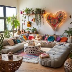 a living room filled with lots of furniture and plants