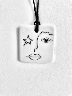 BLACK AND WHITE FACE DECOR Porcelain Hand Painted square necklace and its black leather link. Dimensions: 4x4cm High Temperature Cooking Jewel Stamped, Signed. Each piece is made with delicacy. Your order will be packaged with care and precaution. Email: crea-anne@wanadoo.fr Adjustable White Hand Painted Necklaces, Adjustable White Hand Painted Necklace, Face Decor, Clay Pins, Porcelain Necklace, Black And White Face, Square Necklace, White Face, Painted Porcelain