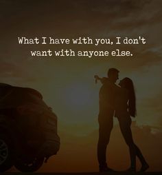 two people standing next to each other in front of a sunset with the words what i have with you, i don't want with anyone else