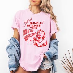 Get ready to spread some holiday cheer with our hilarious group shirt, perfect for your next festive gathering! Featuring the cheeky phrase "Jolliest Bunch of Bitches This Side of the Mistletoe," this shirt is sure to bring a smile to everyone's face. The design is complete with an elegant woman enjoying a glass of wine whilst laughing to herself. This shirt will add a touch of holiday spirit and fun. Made from soft, comfortable fabric, this Comfort Colors shirt is ideal for holiday parties, fam Funny Christmas Shirts Rap Inspired, Holiday Pun Shirts, Bad Moms Christmas Party, Funny Christmas Shirts For Women, Jolliest Bunch, Christmas Shirt Funny, Vampire Makeup, Bad Moms, Bad Mom