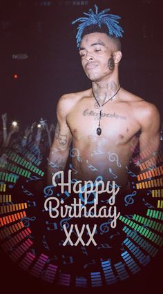 a man with tattoos on his chest standing in front of a birthday card