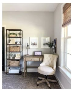 a room with a chair, desk and bookshelf in front of a window