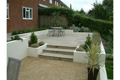 an outdoor patio with steps and seating area