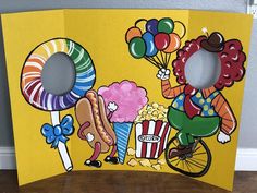 this is an image of a clown riding a bike with popcorn and balloons on it