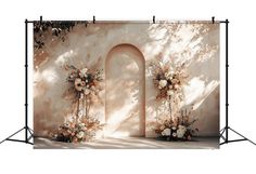 an image of a backdrop for a wedding ceremony with flowers and arches on the wall