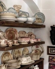 plates and bowls on shelves in a room