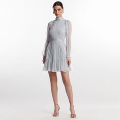 Elegant short dress in gray Bridge silk.  It has pleats, a bow at the back and a marked waist, making it a modern and sophisticated piece of clothing. The high collar and long sleeves add an elegant and refined air, and the tight fit beautifully accentuates the figure. The dress closes with a zipper at the back and a bow at the collar. 100% silk  dry clean Elegant Short Dress, Elegant Dresses Short, August Birthstone Jewelry, July Birthstone Jewelry, Gray Silk, Zodiac Jewelry, Pearl Jewellery Earrings, Jewelry Ring Box, August Birth Stone