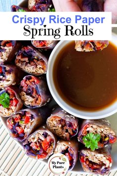 crispy rice paper spring rolls on a plate with dipping sauce in the middle and hands holding