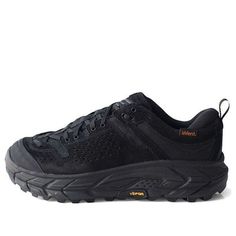 Introducing the Hoka One One Tor Ultra Low WP JP in classic black! This shoe is perfect for the adventurer in you who craves comfort and style. With its low-cut design, the Tor Ultra provides maximum flexibility and ease of movement. Featuring waterproof technology, this shoe is the ideal option for any outdoor activity, even in wet conditions. You can explore your surroundings with ease, protected from the elements, without compromising on style. The Hoka One One Tor Ultra also offers unrivaled Black Rugged Lace-up Walking Shoes, Rugged Black Hiking Boots With Rubber Sole, Leather Trail Running Shoes With Abzorb Midsole For Streetwear, Black Low-top Hiking Boots With Rubber Sole, Black Trail Running Shoes With Abzorb Midsole For Hiking, Black Low-top Trail Running Shoes With Vibram Sole, Black Trail Running Sneakers With Round Toe, Black Leather Sneakers For Outdoor, Black Low-top Leather Hiking Boots