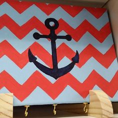 an anchor is painted on a chevron background