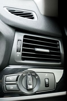 an air conditioner in the middle of a car's dashboard with buttons and controls