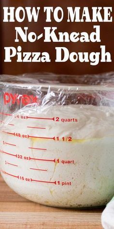 the ingredients for no - knead pizza dough in a measuring cup