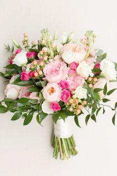 a bridal bouquet with pink and white flowers