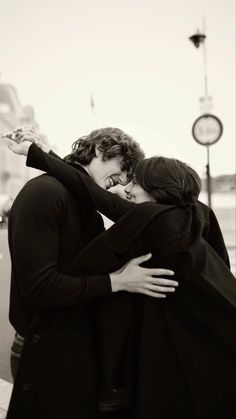 black and white photograph of two people embracing each other