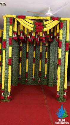 a decorated stage with yellow and red flowers