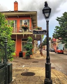 a street light on the corner of a city street