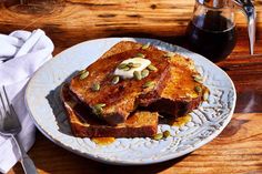 toasted bread with butter and pistachios on a plate