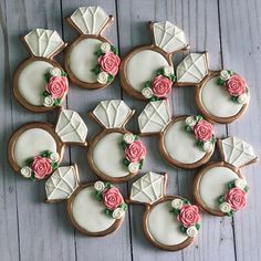 decorated cookies with pink roses and green leaves