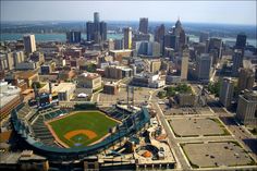 an aerial view of a baseball stadium in the city