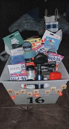 a suitcase filled with lots of items sitting on top of a floor