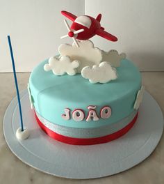 a birthday cake with an airplane on top