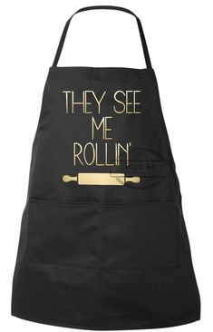 an apron with the words they see me rollin'in gold foil on it