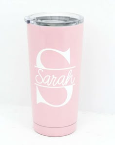 a pink tumbler with the word sarah on it