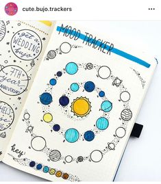 an open notebook with doodles and space images on the pages that read moon tracker