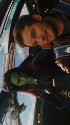 an image of the avengers movie scene from the back seat of a car, with two men standing next to each other