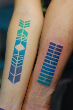 two people with matching tattoos on their arms, one has an arrow and the other has arrows