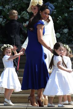 the royal family are all dressed in white and blue