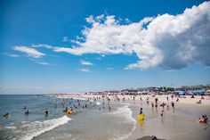 many people are on the beach and in the water at this point, there is no image here to provide a caption for