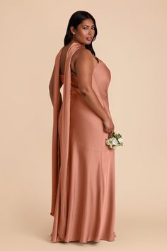 a woman in a long pink dress with a shawl around her neck and back