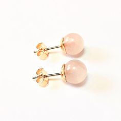 These stud earrings are solid 9ct gold with round pink Rose Quartz gemstones and 9ct gold earring backs. Each Rose Quartz ball measures approximately 6mm / 0.23" diameter.Small, delicate earrings, these studs are very pretty, with the palest pink stones. Each ball is smooth to the touch. Beautifully complimented by the solid gold ear posts and backs. An ideal gift for a loved one; Rose Quartz is known as the 'love stone'.6mm diameter stones.Please take a look at our jewellery section:https://www Pink Gemstone Round Earrings, Rose Gold Round Pierced Earrings, Dainty Pink Round Earrings, Hypoallergenic Rose Gold Round Earrings, Classic Pink Hallmarked Earrings, Rose Gold Birthstone Round Earrings, Rose Gold Round Birthstone Earrings, Rose Gold Birthstone Earrings, Hypoallergenic Pink Gold Earrings Gift