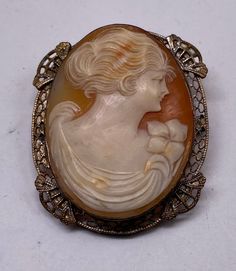 "Beautiful Antique Art Nouveau Silver Filigree Cameo Hand Carved Large Brooch Pin Very Good Pre/owned Condition Measures 1 3/4\" X 1 1/2\" width." Carved Oval Brooch For Formal Occasions, Carved Oval Brooch For Formal Wear, Antique Carved Brooches For Weddings, Ornate Oval Brooch For Formal Occasions, Ornate Oval Brooches For Formal Occasions, Carved Oval Brooches For Formal Wear, Ornate Oval Intaglio Brooches, Carved Brooches For Formal Occasions, Ornate Oval Filigree Brooches