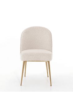 an upholstered chair with wooden legs