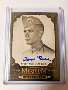 an autographed baseball card is on display