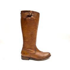 a pair of brown leather boots with buckles