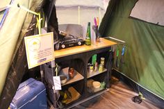 the inside of a tent with various items on it