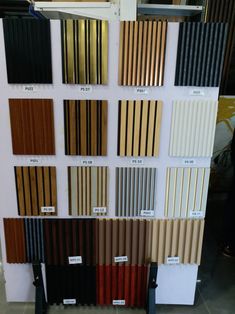 the different colors and sizes of wooden slats are shown in this display case,