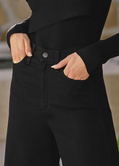 The high-rise, wide leg Mia jean has the comfort and ease of stretch. In an authentic jet black, these jeans are a seasonless, of-the-moment style.This style runs small. Please size up for a better fit. 11 1/2" RISE34" INSEAM63% Cotton, 35% Lyocell, 2% ElastaneMODEL IS WEARING SIZE 26 11 1/2" front rise 15 3/4" back rise 23" leg opening 34" inseam Black Straight Jeans For Fall, Black High Waist Relaxed Fit Flare Jeans, Black High Waist Flare Jeans For Fall, High Waist Black Flare Jeans For Fall, Black High-waisted Jeans, Black High Rise Relaxed Fit Flare Jeans, Black Mid-rise Flare Jeans For Work, Chic Black Straight Leg Flare Jeans, Black Wide Leg Flare Jeans For Work