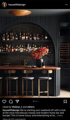 an image of a bar with stools and bottles on the back wall in front of it