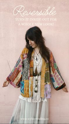 a woman standing in front of a pink wall with her hands on her hippie