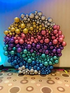 there are many balls in the shape of a rainbow