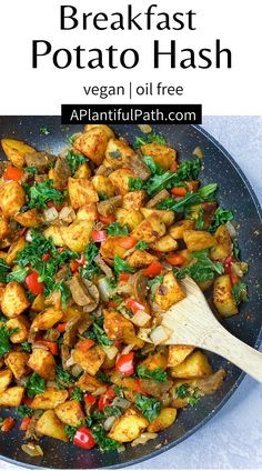 a pan filled with potatoes and vegetables on top of a table