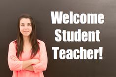 a woman standing in front of a blackboard with the words welcome student teacher