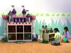 two children are playing in front of a castle with princess's castle on the wall